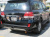 Toyota Land Cruiser 200 (08-) хромированная накладка на заднюю дверь - рамка с фонарями подсветки номерного знака